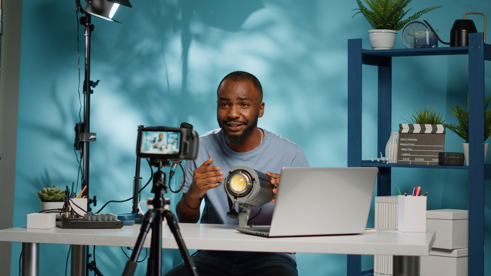 african american blogger reviewing studio light camera